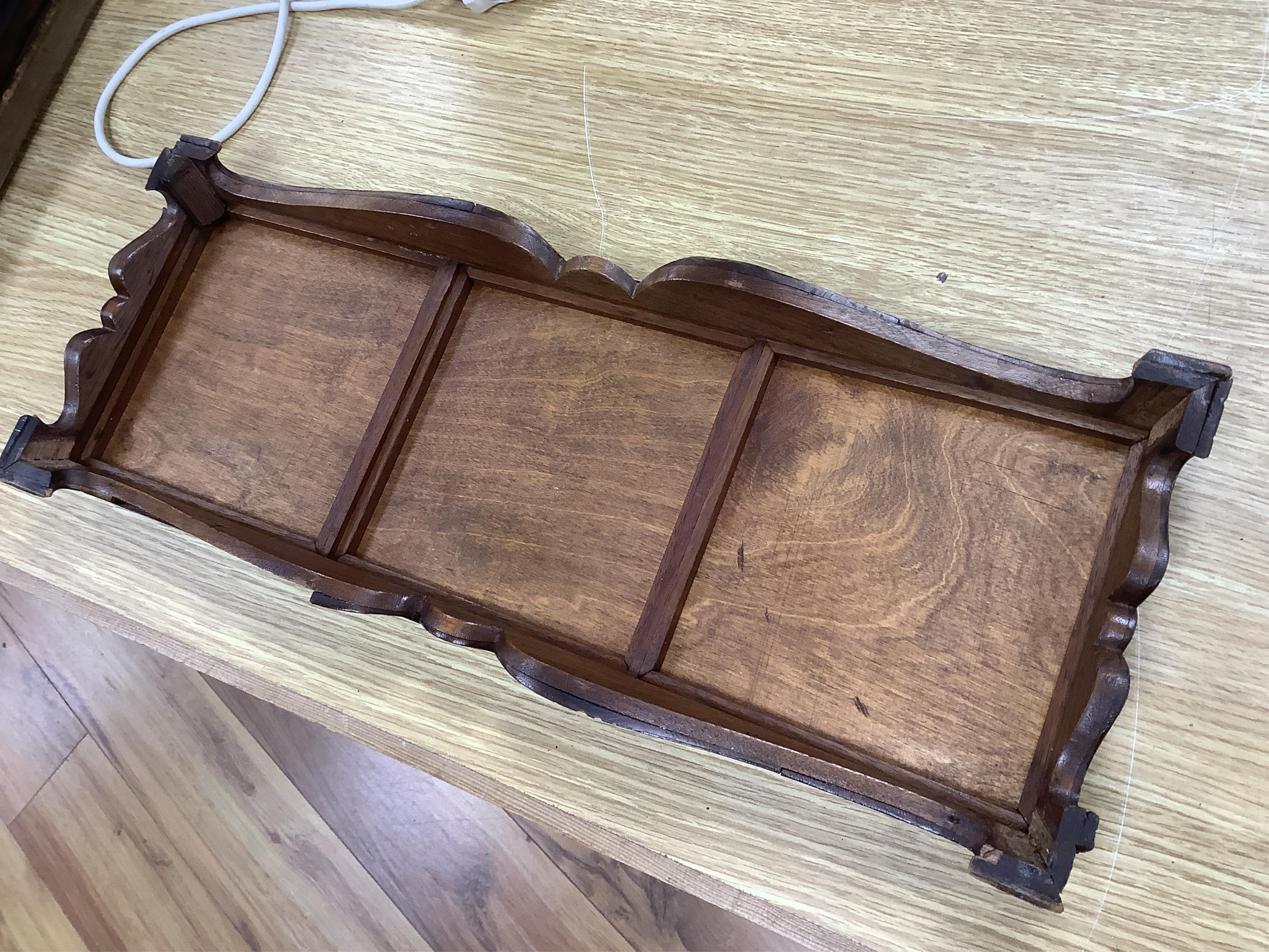 A 19th century Delft tile inset walnut stand, 49cm wide. Condition - poor